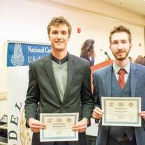 students accepting their certificates