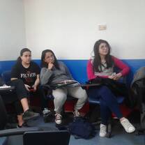 five people lietening to the speaker