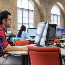a man studying on computer