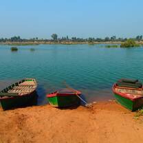three boats on a seashore