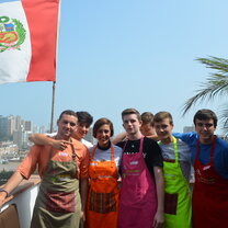 EdOdyssey custom secondary programs in Peru, China, Spain, Italy and USA group of students next to Peru flag