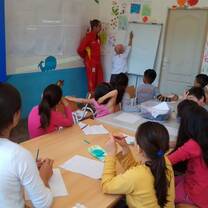 kids and teens sitting inside the classroom