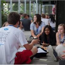 students sitting on the floor while chatting