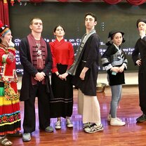 EdOdyssey custom secondary programs in Peru, China, Spain, Italy and USA group standing in traditional Chinese outifts together