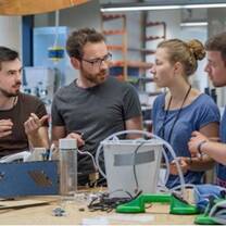 Four people discussing on something