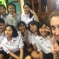 Me in my first week at school, sitting on the floor of my office getting to know some of my students.