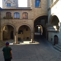 Picturesque Italian made white FIAT 500 in a hidden corner. Piazza San Pelligrino; the heart of the Medival city.