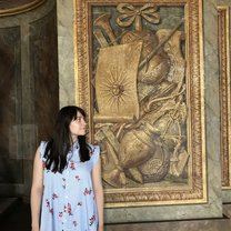 Next to the face of the Sun King at the Palace of Versailles