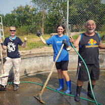 Volunteers Scrubbing Out A Bear Pool