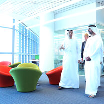Khalifa University directors and leadership walk through the modern campus in traditional Arabic clothes.  Khalifa University directors and leadership walk through the modern campus in traditional Arabic clothes.