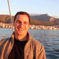 Image of student, backed by Table Bay and the Cape Town skyline