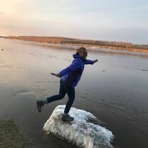 Standing on ice during the spring ice break on the Lena River