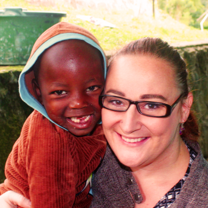 Child and Volunteer Smiling 
