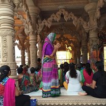 a woman praying at the temple near my home