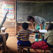 Volunteer teacher in Ugandan classroom