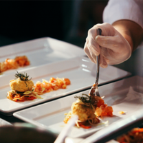Hand fixing dish in culinary class