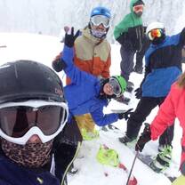 Group of people skiing and snowboarding