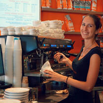 Woman acting as barista