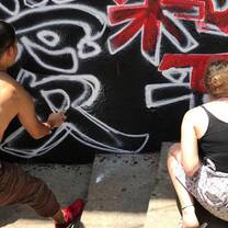 teaching mural painting in Brazil