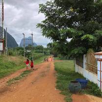 Children jumping ropes on the road outside the project house.