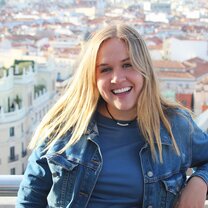 On top of a building in Madrid. Looking at the whole city with a huge smile on my face!