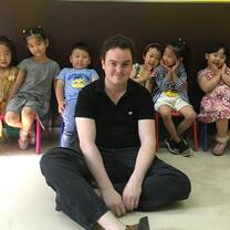 Happy teacher with students