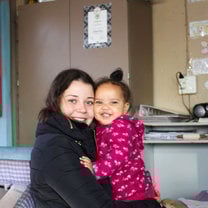 Baby girl and volunteer 