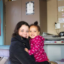 Baby girl and volunteer 