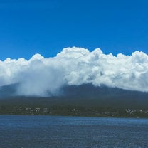 Mount Fuji (known as Fuji-san) under a shroud of clouds.