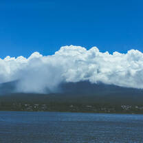 Mount Fuji (known as Fuji-san) under a shroud of clouds.