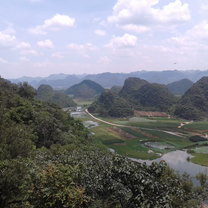 This amazing overlook can be seen from the top of Qinglong mountain in the scenic town Puzhehei. Located several hours from Kunming, Puzhehei is conveniently reachable by high-speed rail.