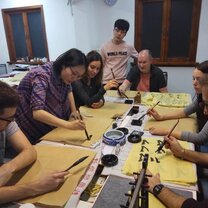 Students taking a calligraphy class Take a calligraphy class in China