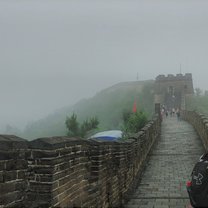  a section of the famous great wall, with heavy mist in the background 