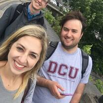 people smiling wearing DCU shirt