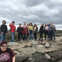 group standing on rocks