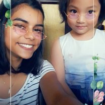 One of the twins fascinated by snapchat filters