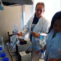 Scientists measuring microplastic levels in lab