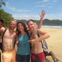 group posing on the beach 