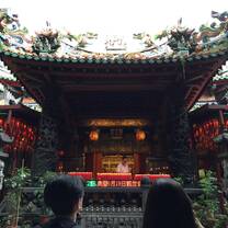 A large temple in Ximen district, lit by the glow of red lanterns.