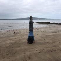 Just a handstand on one of NZ's many beaches with one of its many volcanoes in the background as well!