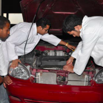 # people working on a car