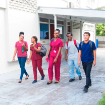 People walking next to school