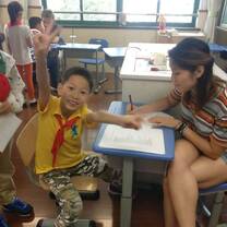 Working one on one with students in China