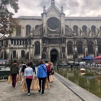 Handing out care bags in front of a cathedral 