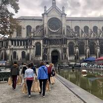 Handing out care bags in front of a cathedral 
