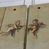 A favorite image from the trip: baby angels tearing down the concreted separation wall in Bethlehem