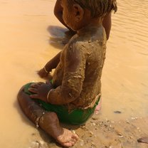 Baby in the mud pool