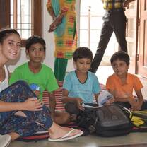 Volunteer from Portugal teaching children in Delhi, India with The Tarzan Way