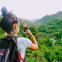 Volunteer pausing to take a picture in Rishikesh, India with The Tarzan Way