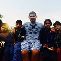 Volunteer from Bahrain having fun with children in Jaipur, India with The Tarzan Way